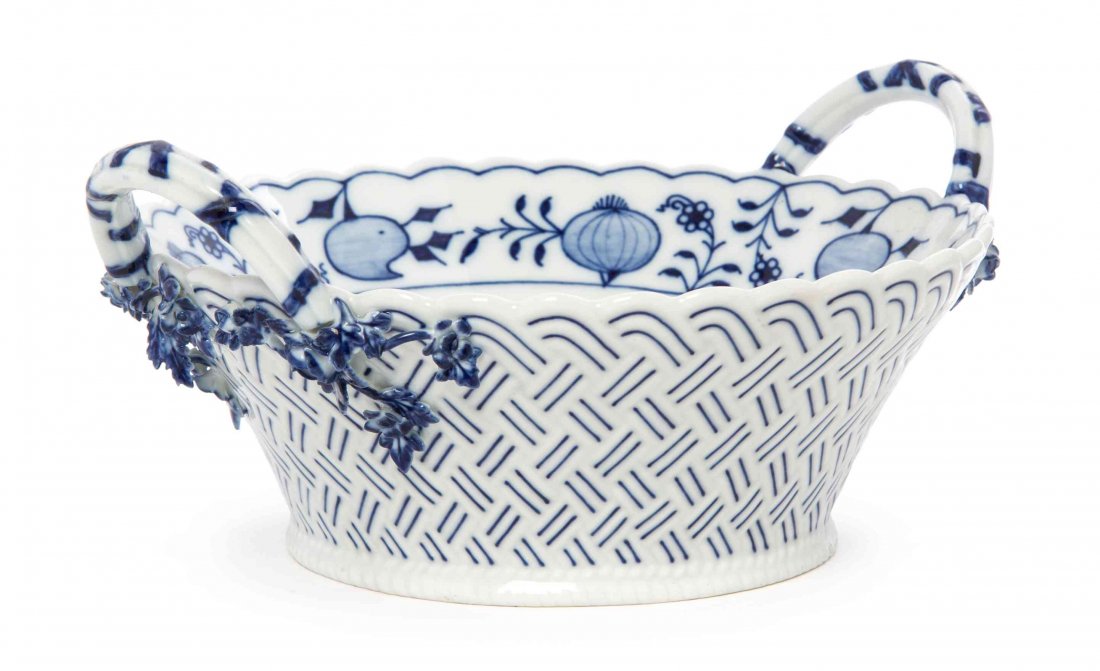 A German Porcelain Blue Onion Twin Handled Bowl, Width: A German Porcelain Blue Onion Twin Handled Bowl, of cylindrical tapering basketweave form, bearing crossed swords in underglaze blue mark to the underside. Width over handles 9 1/8 inches.
