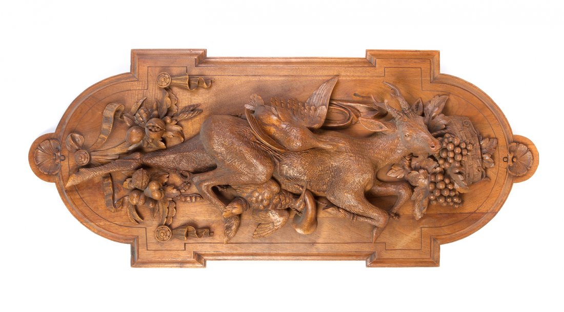 A Continental Carved Walnut Game Trophy, Height 39 1/2: A Continental Carved Walnut Game Trophy, depicting a stag and quail with grapes and nuts. Height 39 1/2 inches.