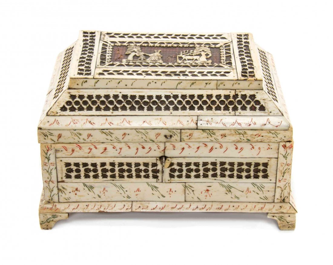 A Russian Bone Veneered Table Casket, Height 5 3/4 x: A Russian Bone Veneered Table Casket, opening to a vacant paper lined interior and raised on bracket feet. Height 5 3/4 x width 9 x depth 6 inches.