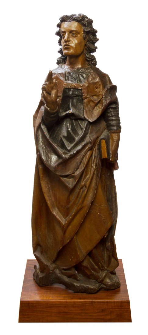 A Continental Carved and Polychrome Oak Figure, 16TH: A Continental Carved and Polychrome Oak Figure, 16TH CENTURY, worked to show John the Apostle. Height 42 inches. Condition: restored