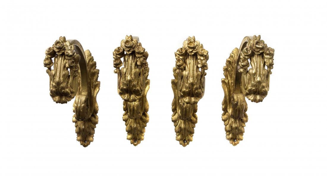 A Set of Four Gilt Bronze Curtain Tiebacks, Height 7: A Set of Four Gilt Bronze Curtain Tiebacks, each cast to show acanthus leaves and floral garlands. Height 7 1/2 inches. Property of a Lady, St. Augustine, Florida