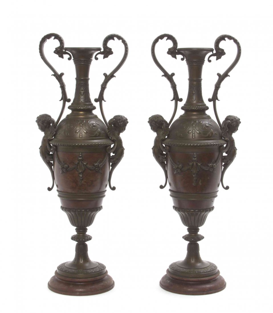 A Pair of Neoclassical Bronzed Urns, Height 15 inches.: A Pair of Neoclassical Bronzed Urns, each of baluster handled form, raised on a circular foot. Height 15 inches. Property from the Estate of William Collins, Saint Charles, Illinois