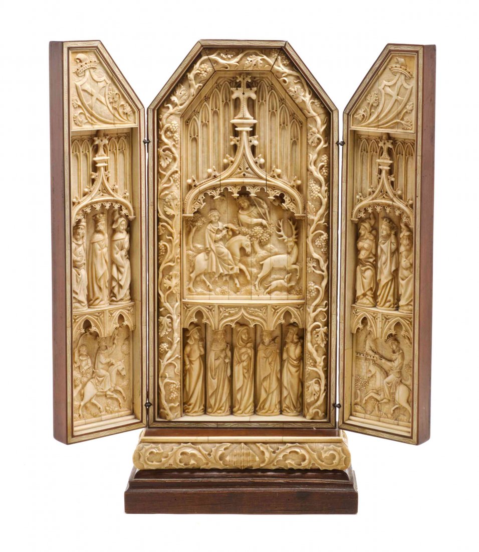 A Continental Bone Three-Panel Triptych, 17TH/18TH: A Continental Bone Three-Panel Triptych, 17TH/18TH CENTURY, THE FRAME LATER, each panel carved to show saints and mounted figures beneath Gothic architectural arches, the center section with a continu