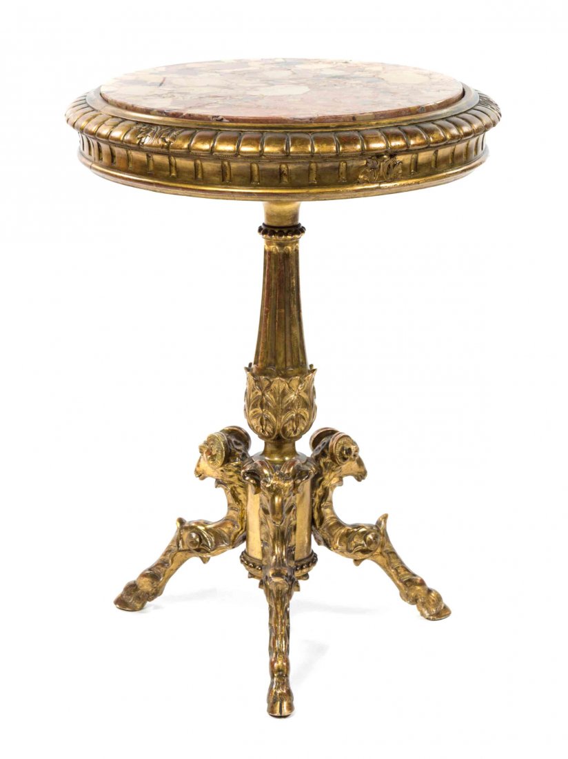 A Neoclassical Giltwood Pedestal Table, Height 30 3/4 x: A Neoclassical Giltwood Pedestal Table, having a circular marble inset top over a dentiled frieze, set on a tapering fluted standard, raised on a tripod ram mask carved base ending in monoped supports