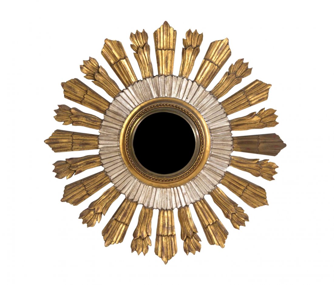 A Gilt and Silvered Wood Sunburst Mirror, Diameter 29: A Gilt and Silvered Wood Sunburst Mirror, having a circular convex plate within a carved frame issuing stylized solar rays. Diameter 29 3/4 inches.