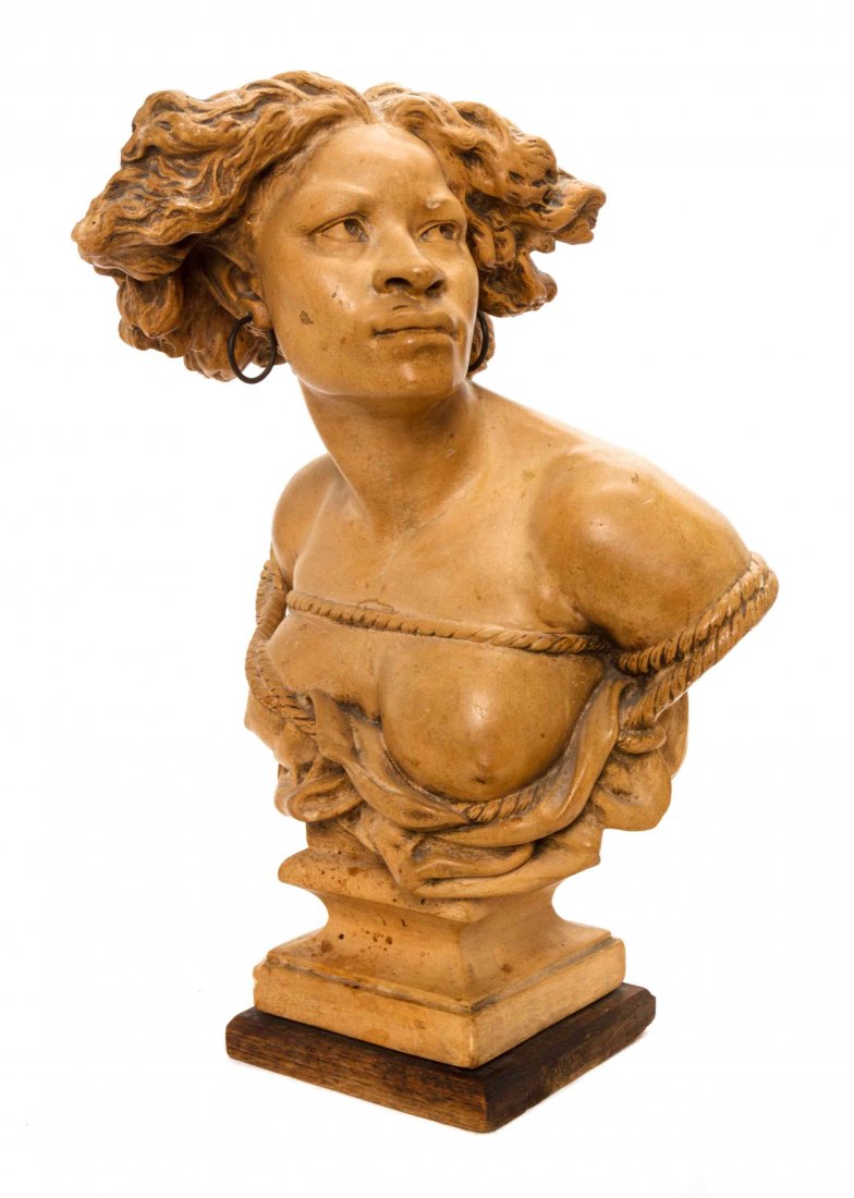 A Continental Terra Cotta Bust, AFTER JEAN-BAPTISTE: A Continental Terra Cotta Bust, AFTER JEAN-BAPTISTE CARPEAUX (FRENCH, 1827-1875), La Negresse, depicting a bound African woman with one exposed breast, signed F. Carli d'apres Carpeaux. Height 20 1/2