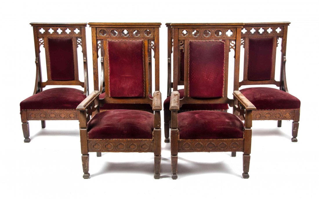 A Set of Eight Gothic Revival Oak Chairs, Height of: A Set of Eight Gothic Revival Oak Chairs, comprising two armchairs and six side chairs, each with upholstered back and seat, raised on square legs. Height of armchairs 50 1/2 inches.