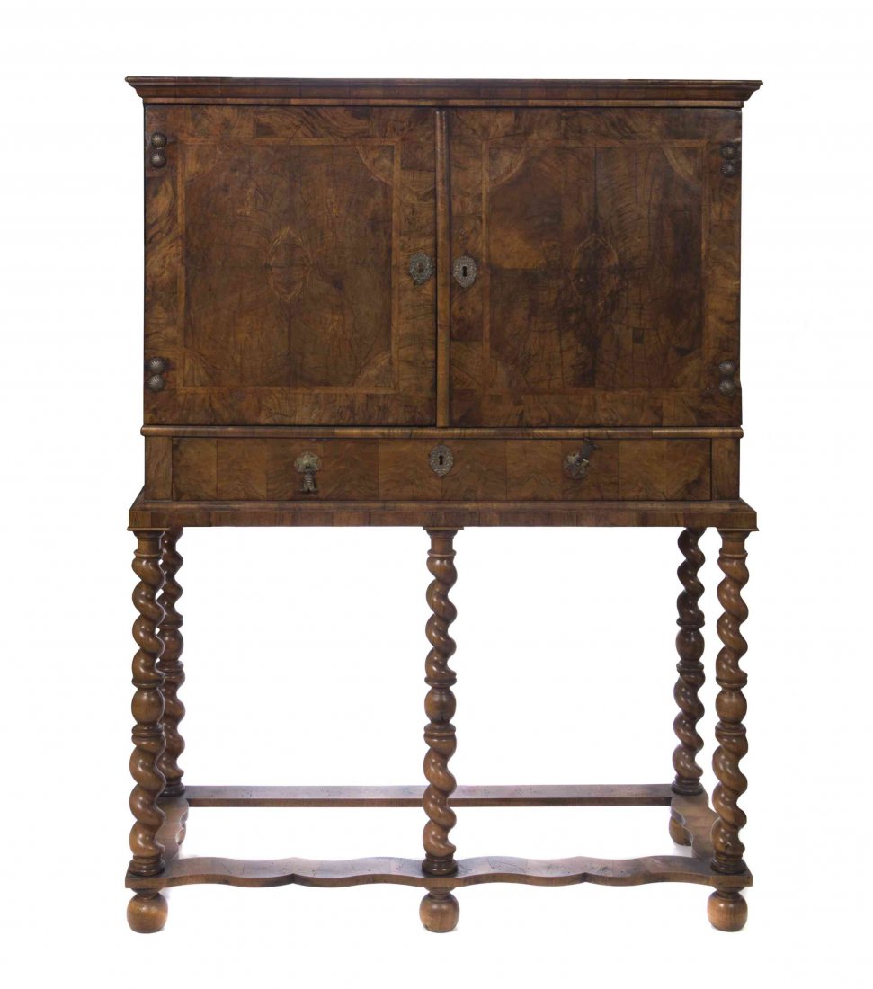 A William and Mary Walnut Chest on Stand, LATE 17TH: A William and Mary Walnut Chest on Stand, LATE 17TH CENTURY, having a rectangular top over a pair of cupboard doors opening to a fitted interior above a drawer, raised on a later stand. Height 60 x wi