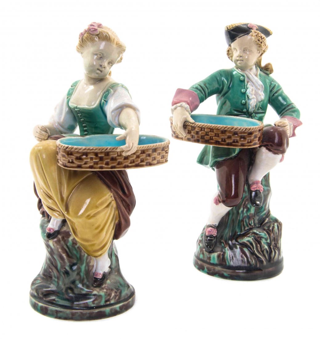 A Pair of Minton Majolica Figures, Height 7 1/2 inches.: A Pair of Minton Majolica Figures, in the form of a boy and a girl with baskets. Height 7 1/2 inches. Property of a Lady, St. Augustine, Florida