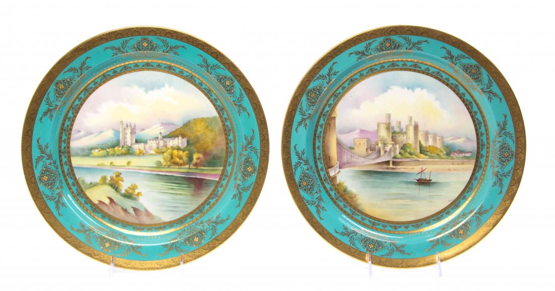 A Pair of Minton Porcelain Chargers, SECOND HALF 19TH: A Pair of Minton Porcelain Chargers, SECOND HALF 19TH CENTURY, depicting Balmoral Castle and Conway Castle, each signed J. Cole, within gilt decorated turquoise borders. Diameter 13 inches. Property f