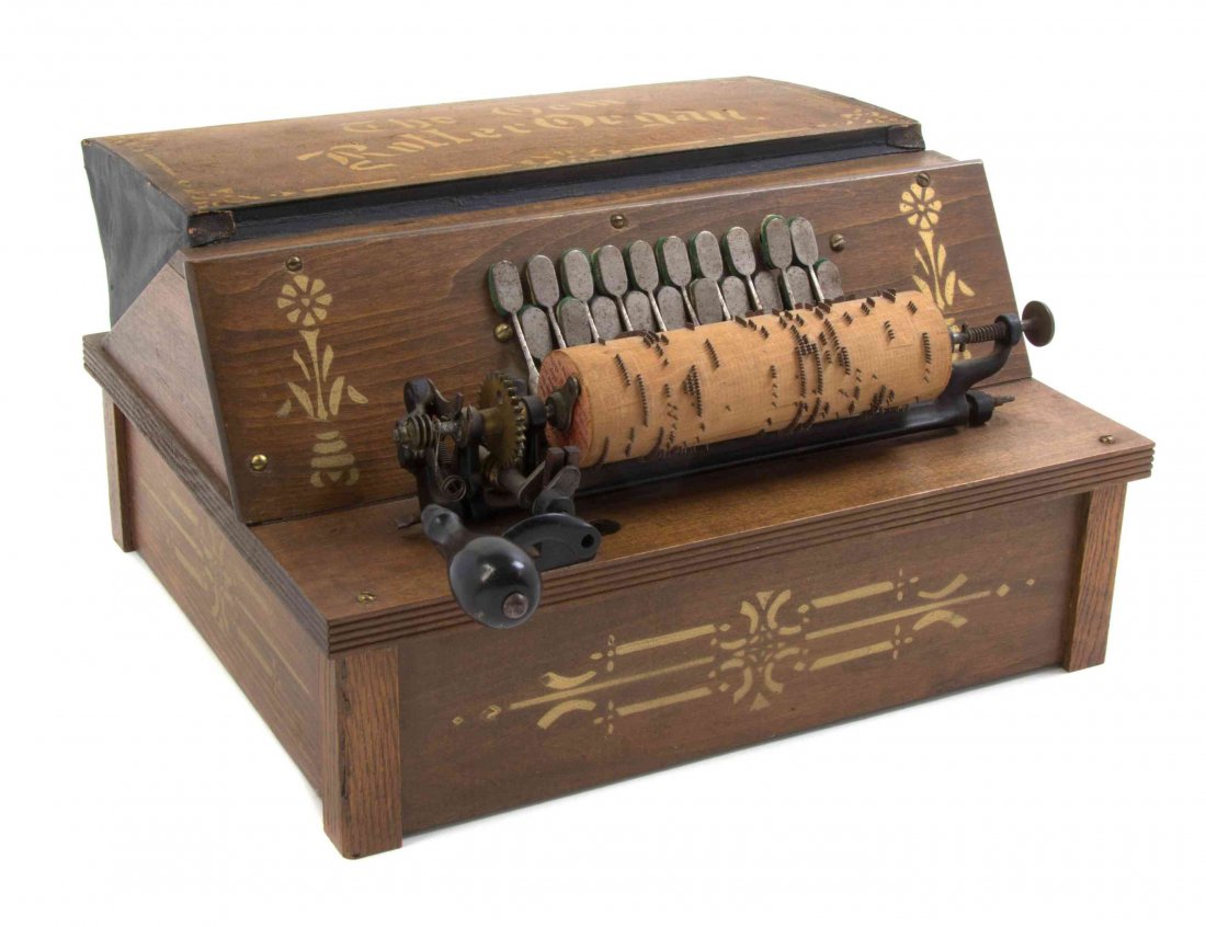 A Gem Roller Organ, AUTOPHONE CO., Height 7 3/4 x width: A Gem Roller Organ, AUTOPHONE CO., in a stenciled case, playing on a 6 1/4 inch roll, with seven additional rolls. Height 7 3/4 x width 14 1/4 x depth 11 3/4 inches. Property from the Estate of Paul a