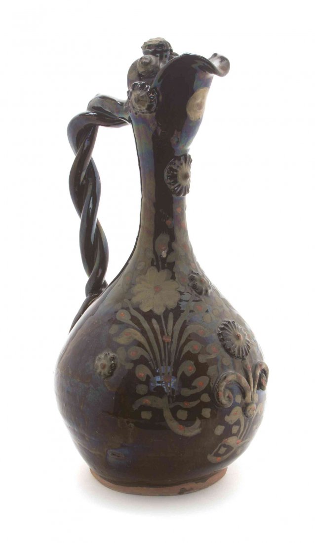 A Turkish Chanakkale Ewer, Height 15 1/2 inches.: A Turkish Chanakkale Ewer, of baluster form, having a spiral twist handle mounted to the baluster form body painted to show floral sprays. Height 15 1/2 inches.
