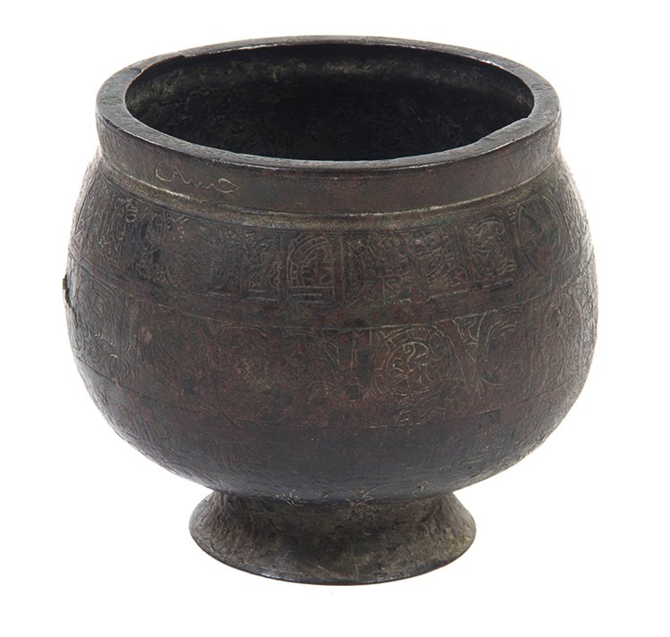A Middle Eastern Iron Bowl, Height 6 x diameter 5 3/4: A Middle Eastern Iron Bowl, of circular bulbous form with incised script throughout. Height 6 x diameter 5 3/4 inches.