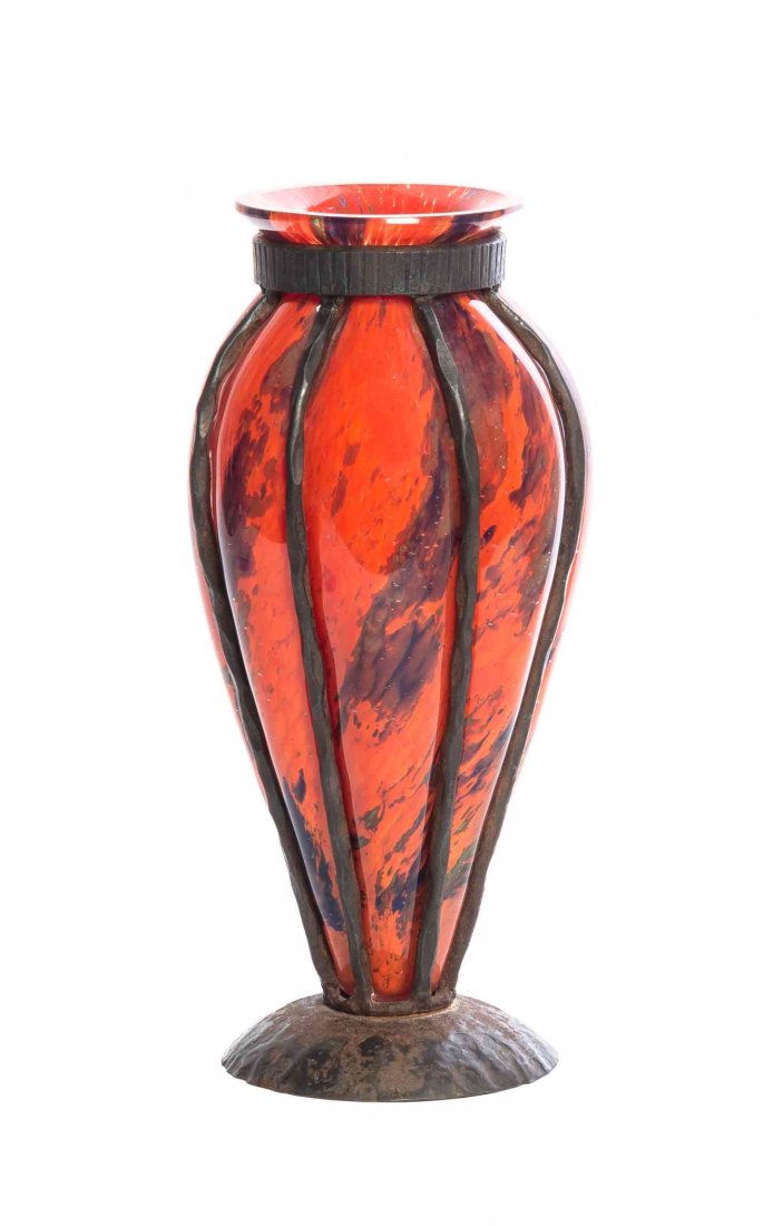 A Daum Blown-Out Glass and Iron Mounted Vase, Height 9: A Daum Blown-Out Glass and Iron Mounted Vase, of tapering form, with lobbed decoration and a red ground, etched Daum Nancy France with the Cross of Lorraine. Height 9 1/2 inches.