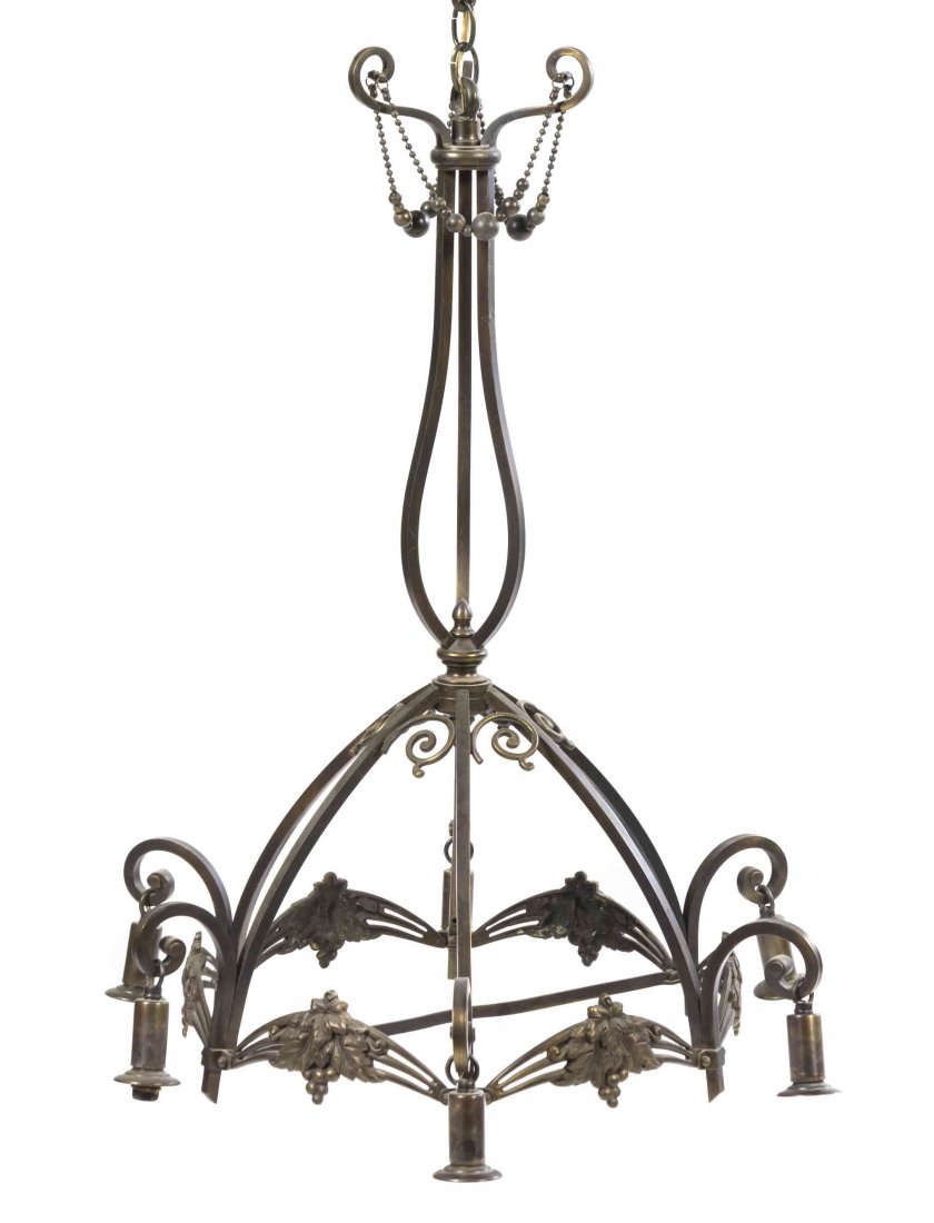 A Charles Schneider Modeled Glass and Iron Six-Light: A Charles Schneider Modeled Glass and Iron Six-Light Chandelier, the central diffuser surrounded by six drop pendants, with a brown to yellow ground, the central diffuser with an enameled signature. H
