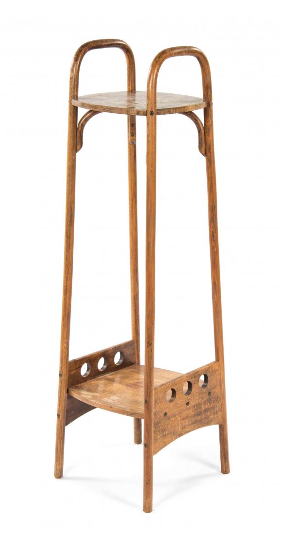 An Otto Prutscher Beech Etagere, for Thonet, Height 48: An Otto Prutscher Beech Etagere, for Thonet, model number 9522, having a rectangular top, above a medial shelf with a pierced border, raised on twin supports. Height 48 1/8 x width 13 1/2 x depth 13 1