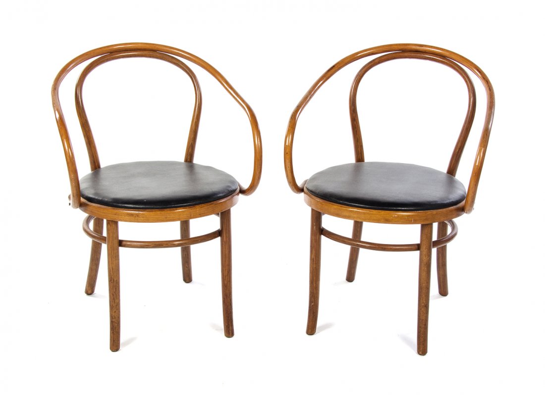 A Pair of Thonet Bentwood Armchairs, Height 31 1/2: A Pair of Thonet Bentwood Armchairs, model number 9, introduced in 1902-3, each having a curved crest rail over an upholstered seat within curved arms, raised on cylindrical legs joined by a stretcher