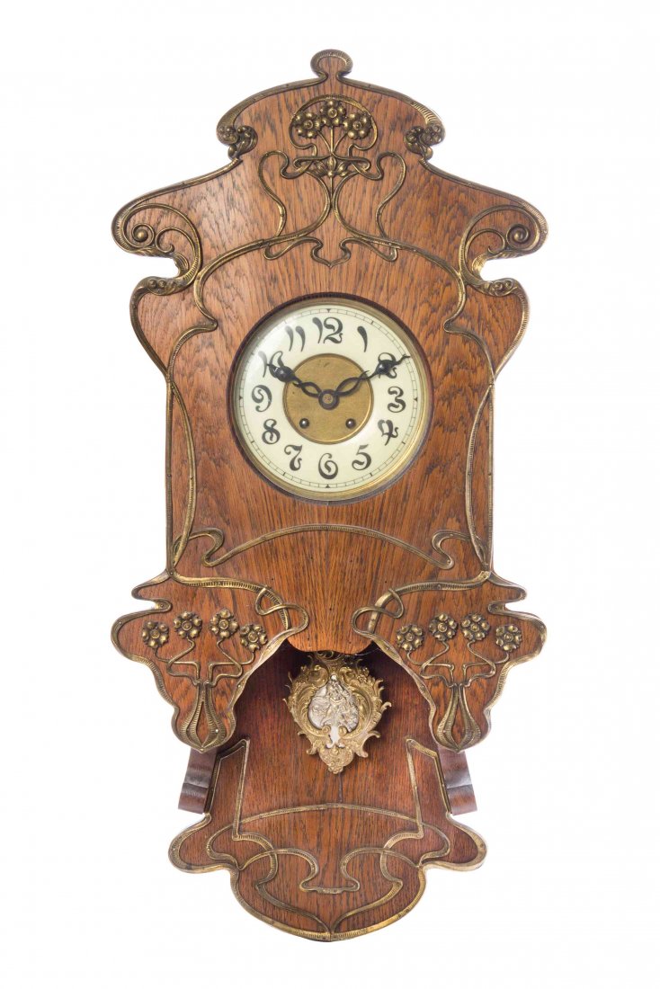 An Art Nouveau Oak and Gilt Metal Mounted Wall Clock,