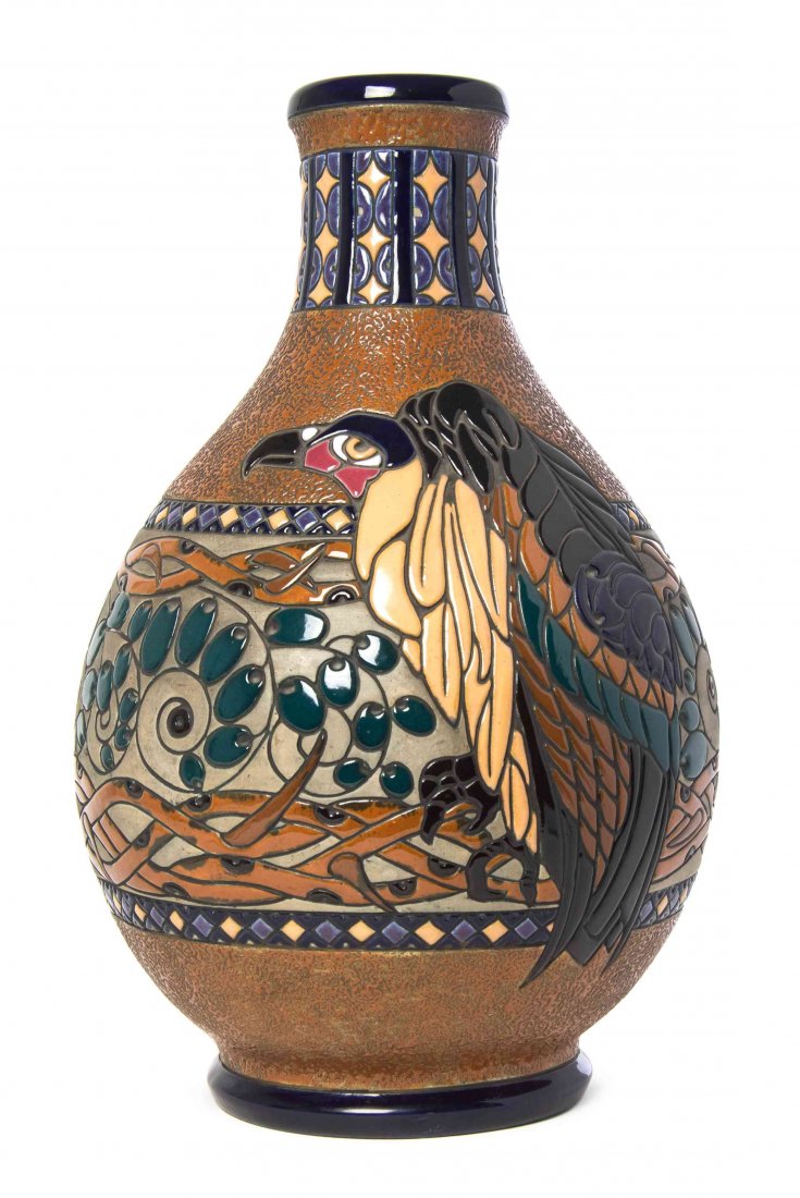 A Czechoslovakian Amphora Pottery Vase, Height 20: A Czechoslovakian Amphora Pottery Vase, of baluster form, with geometric bands, centered with a stylized vulture amongst fruit laden vines, stamped Made in Czechoslovakian, Amphora, numbered 15079. He