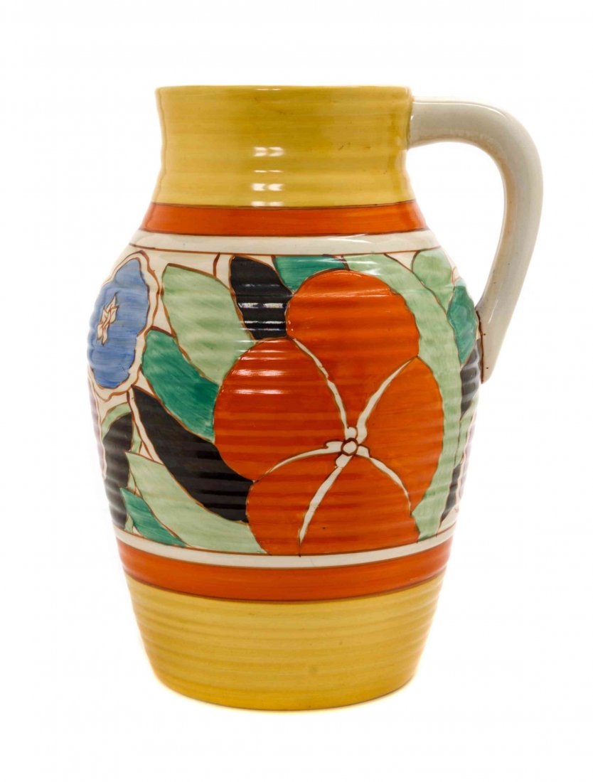 A Clarice Cliff Bizarre Ware Pottery Lotus Jug, Height: A Clarice Cliff Bizarre Ware Pottery Lotus Jug, in the Gardenia pattern, of tapering ribbed form, the central band with flower decoration, marked with Fantasque Handpainted, Bizarre by Clarice Cliff.