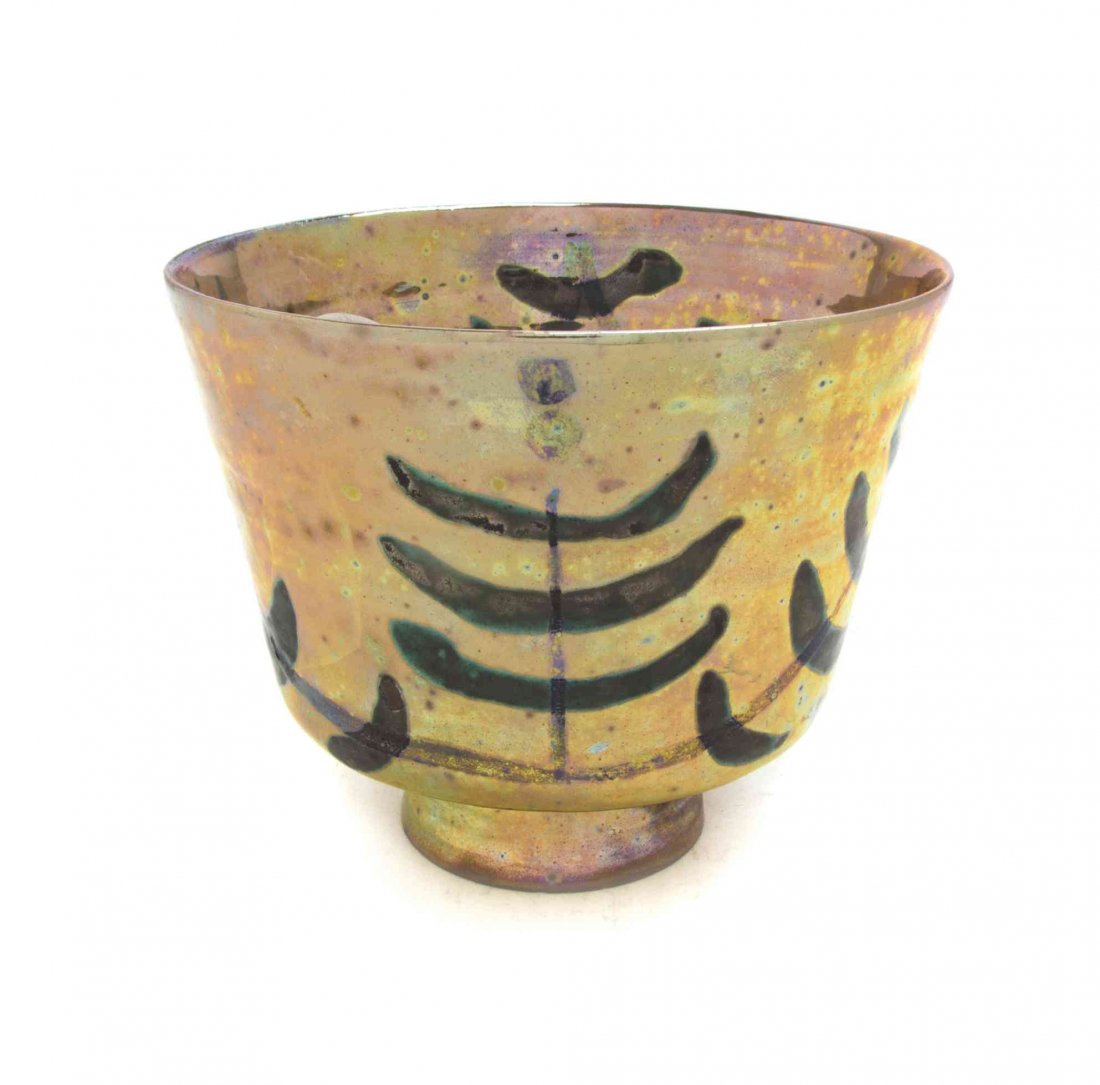 A Beatrice Wood Iridescent Pottery Vase, (American,: A Beatrice Wood Iridescent Pottery Vase, (American, 1893-1998), of tapering ribbed form, with abstract decoration throughout, signed Beato. Height 5 inches. Property from the Estate of Jean Friendland