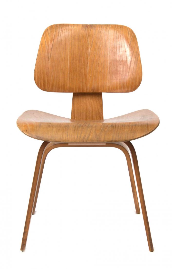 A Charles and Ray Eames Bentwood DCW Chair, Height 27: A Charles and Ray Eames Bentwood DCW Chair, with a laminate back and seat, raised on twin supports. Height 27 inches. Property from the Estate of Jean Friedlander, Milwaukee, Wisconsin