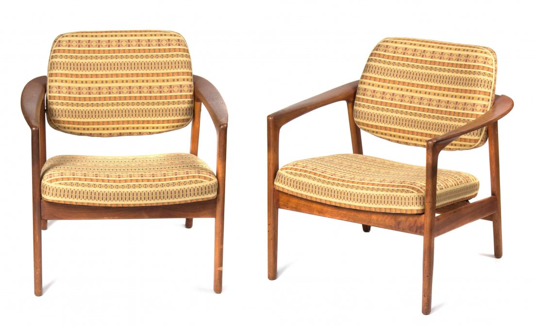 A Pair of Dux Teak Lounge Chairs, Height 30 inches.: A Pair of Dux Teak Lounge Chairs, each having an upholstered back and seat, raised on tapering legs joined by stretchers. Height 30 inches. Property from the Estate of Jean Friedlander, Milwaukee, Wis