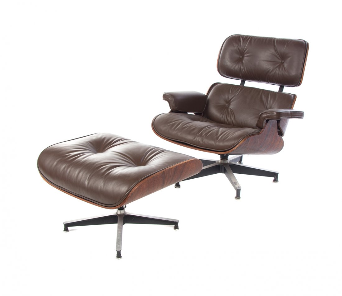 A Charles and Ray Eames Rosewood 670 Lounge Chair and: A Charles and Ray Eames Rosewood 670 Lounge Chair and 671 Ottoman, the chair having an upholstered tufted back and seat, raised on an enameled aluminum base, the ottoman with a tufted upholstered seat
