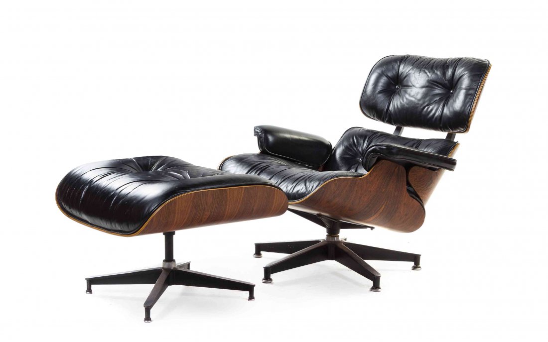 A Charles and Ray Eames Rosewood 670 Lounge Chair and: A Charles and Ray Eames Rosewood 670 Lounge Chair and 671 Ottoman, the chair having an upholstered tufted back and seat, raised on an enameled aluminum base, the ottoman with a tufted upholstered seat