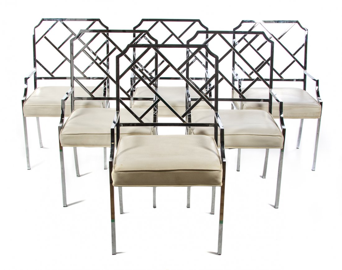 A Set of Six Chromed Armchairs, in the manner of Milo: A Set of Six Chromed Armchairs, in the manner of Milo Baughman, each with a squared back, having lattice decoration in the Chippendale style over the upholstered seat, together with an associated tabl