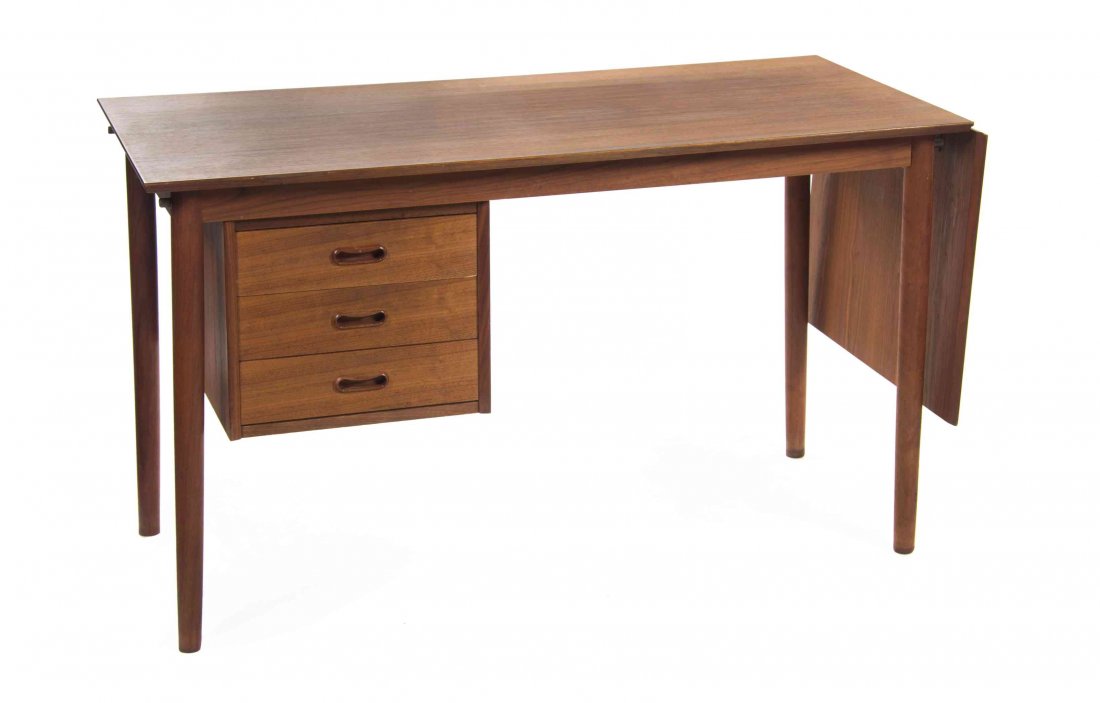 An Arne Vodder Teak Drop Leaf Desk, for Johannes: An Arne Vodder Teak Drop Leaf Desk, for Johannes Hansen, having a rectangular top, with a drop leaf, over three sliding short drawers, raised on tapering cylindrical legs. Height 28 1/8 x width 47 1/2