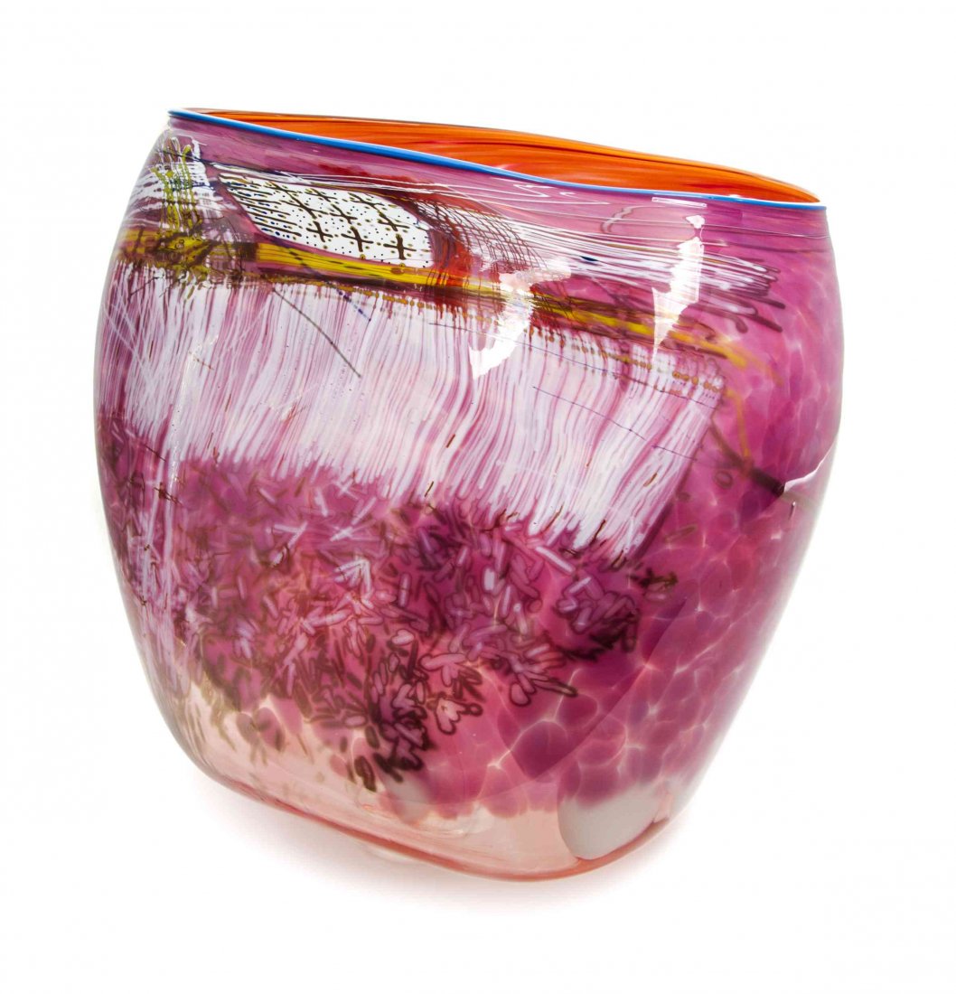 An American Studio Glass Basket, Dale Chihuly (b.: An American Studio Glass Basket, Dale Chihuly (b. 1941), from the Soft Cylinder series, of tapering form with a pink ground and a blue lip wrap, signed and dated 1989. Height 16 x width 17 x depth 15