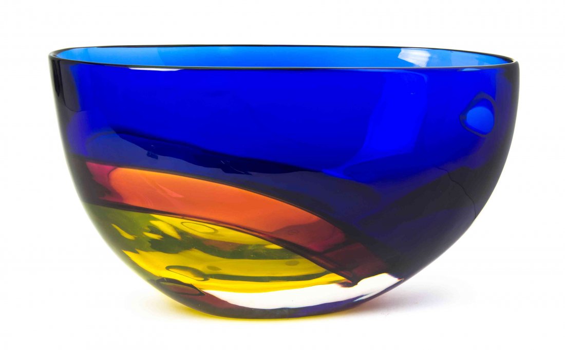 An Italian Studio Glass Center Bowl, Archimede Seguso: An Italian Studio Glass Center Bowl, Archimede Seguso for Tiffany, of flattened tapering form with a blue to red to yellow ground, etched Archimede Seguso Murano, bearing the original sticker. Width 1