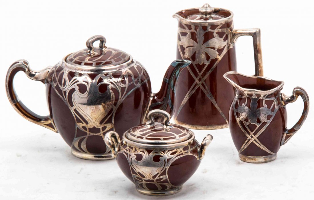 A Lenox Silver Overlay Tea Set, Height of tallest 5 3/8: A Lenox Silver Overlay Tea Set, comprising a teapot, covered sugar, creamer and milk pitcher. Height of tallest 5 3/8 inches. Property from the Hugh Johnston Hubbard Trust, Lake Forest, Illinois