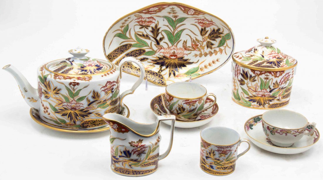 An Assembled English Porcelain Tea Set, Width of first: An Assembled English Porcelain Tea Set, in the Imari pattern, comprising a teapot, a covered sugar, a creamer, two trays, eight cups and five saucers; 18 items total. Width of first over handle 10 1/4