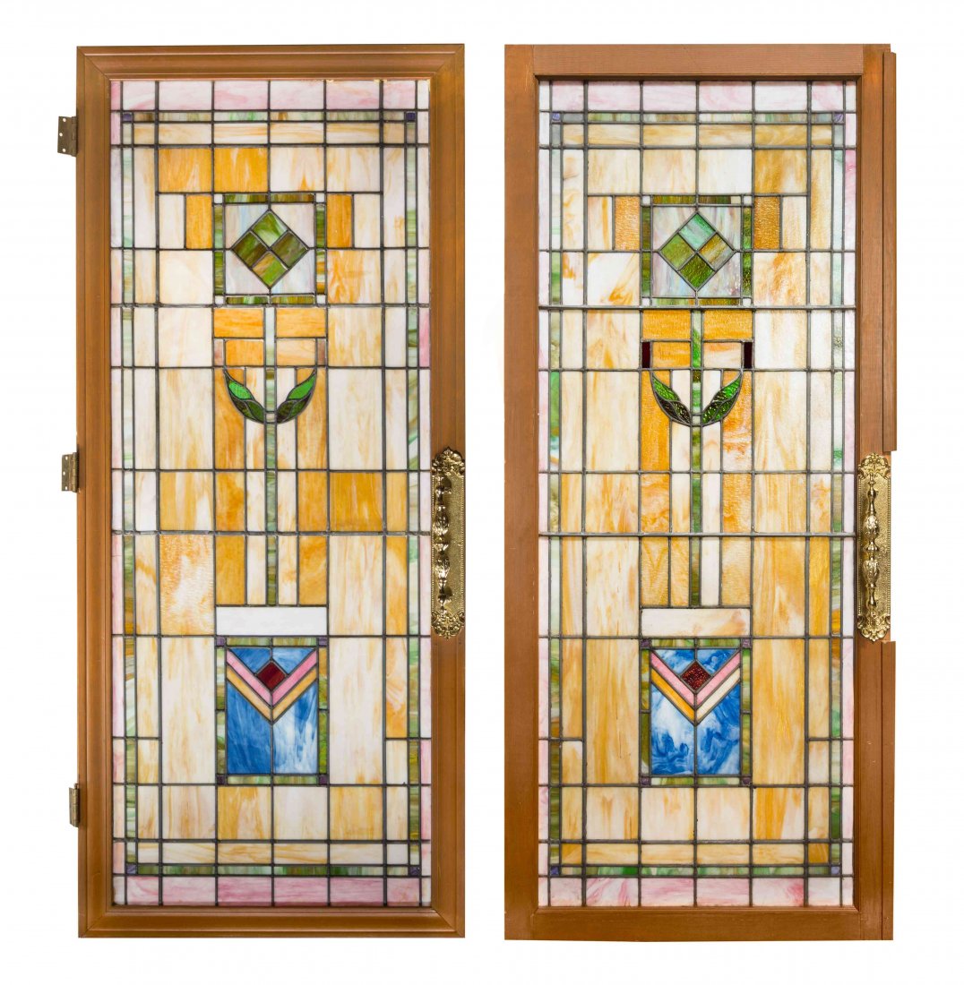 A Pair of American Leaded Glass Windows, Height 83 1/2: A Pair of American Leaded Glass Windows, with geometric decoration, set in wood frames as doors with brass hardware. Height 83 1/2 x width 36 3/8 inches. Property from the Estate of a Prominent Midwes