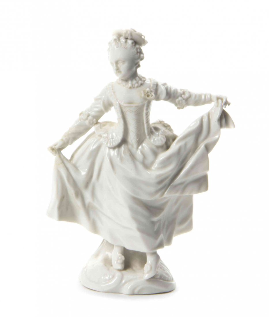 A Nymphenburg Blanc de Chine Figure, Height 6 inches.: A Nymphenburg Blanc de Chine Figure, depicting a girl curtsying, bearing an impressed shield and a blue underglaze crowned JC mark to the underside. Height 6 inches. Condition: Good condition without 