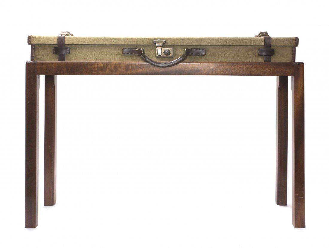 A Canvas Scottish Gun Case on Stand, Height overall 23: A Canvas Scottish Gun Case on Stand, the rectangular case having leather straps and handle with metal lock. Height overall 23 x width 33 inches. Condition: clasp locked and lacking key; associated sta