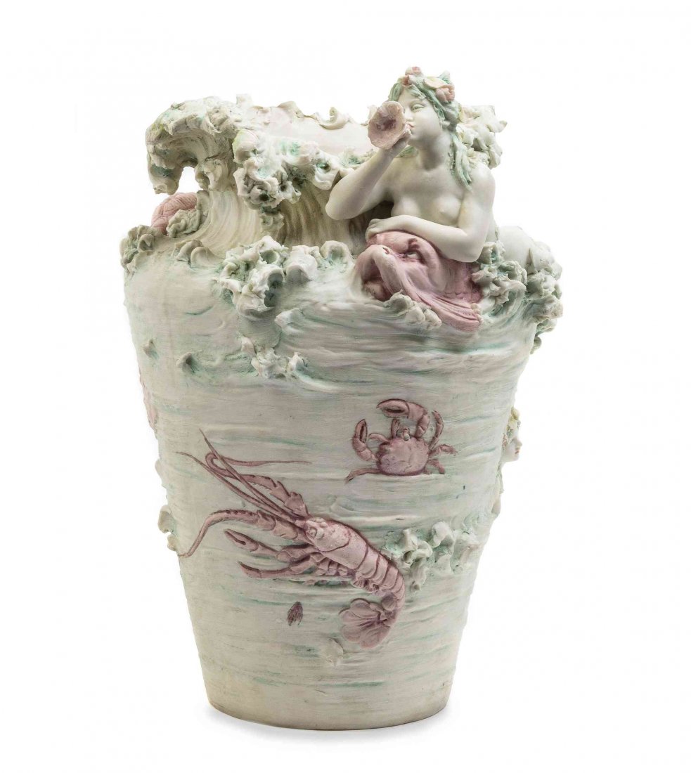 A Royal Dux Bohemia Sea Vase, Height 15 inches.: A Royal Dux Bohemia Sea Vase, of baluster form having a wave form mouth, the body applied with various mermaids and sea creatures, with triangular mark to base, further numbered 182. Height 15 inches.
