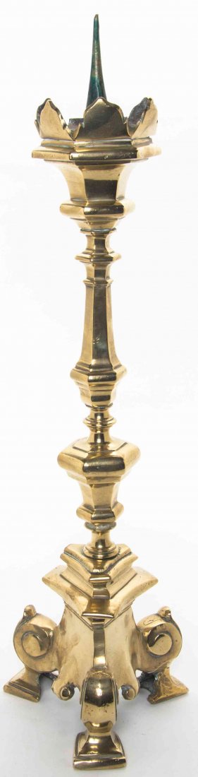 A Baroque Style Bronze Pricket Stick, Height 19 inches.: A Baroque Style Bronze Pricket Stick, of shaped hexagonal form, raised on a tripartite base. Height 19 inches.