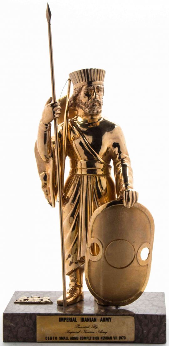 An Iranian Gilt Bronze Figure, Height overall of figure: An Iranian Gilt Bronze Figure, depicted standing with a spear and shield, set on a stone base, the plaque reading Imperial Iranian Army, Presented by Imperial Iranian Army, CENTO, Small Arms Competiti