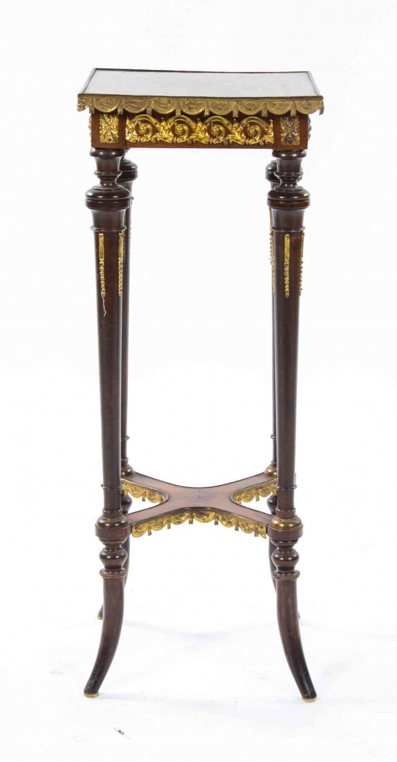 A Napoleon III Gilt Metal Mounted Pedestal Table,: A Napoleon III Gilt Metal Mounted Pedestal Table, having a square top raised on tapering legs joined by an X-form stretcher. Height 31 x width 12 x depth 12 inches.