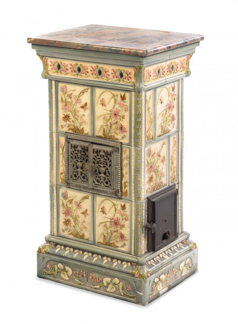 An Aesthetic Movement Ceramic Stove, Height 34 x width: An Aesthetic Movement Ceramic Stove, decorated with flowers and butterflies. Height 34 x width 19 1/8 x depth 15 3/8 inches. Property from the Estate of Robert P. Stupp, Saint Louis, Missouri