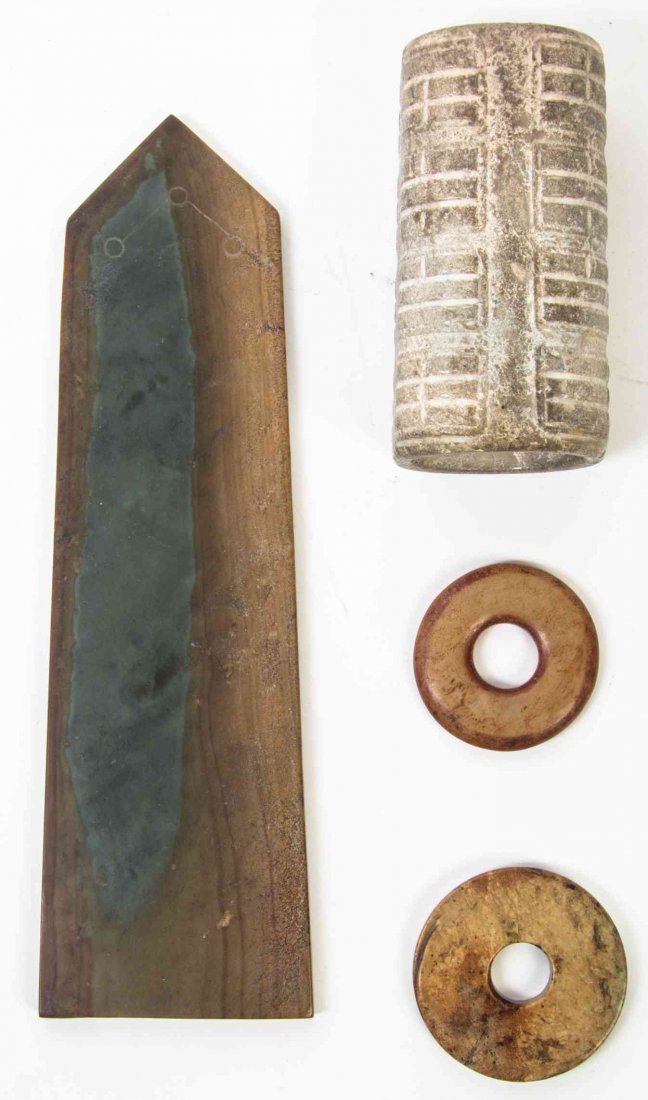 A Group of Archaistic Chinese Stone Articles, Length of: A Group of Archaistic Chinese Stone Articles, comprising a cong with horizontally carved ribs, two bi discs and an axe with incised pictographs. Length of longest 10 1/8 inches. Property from the Esta