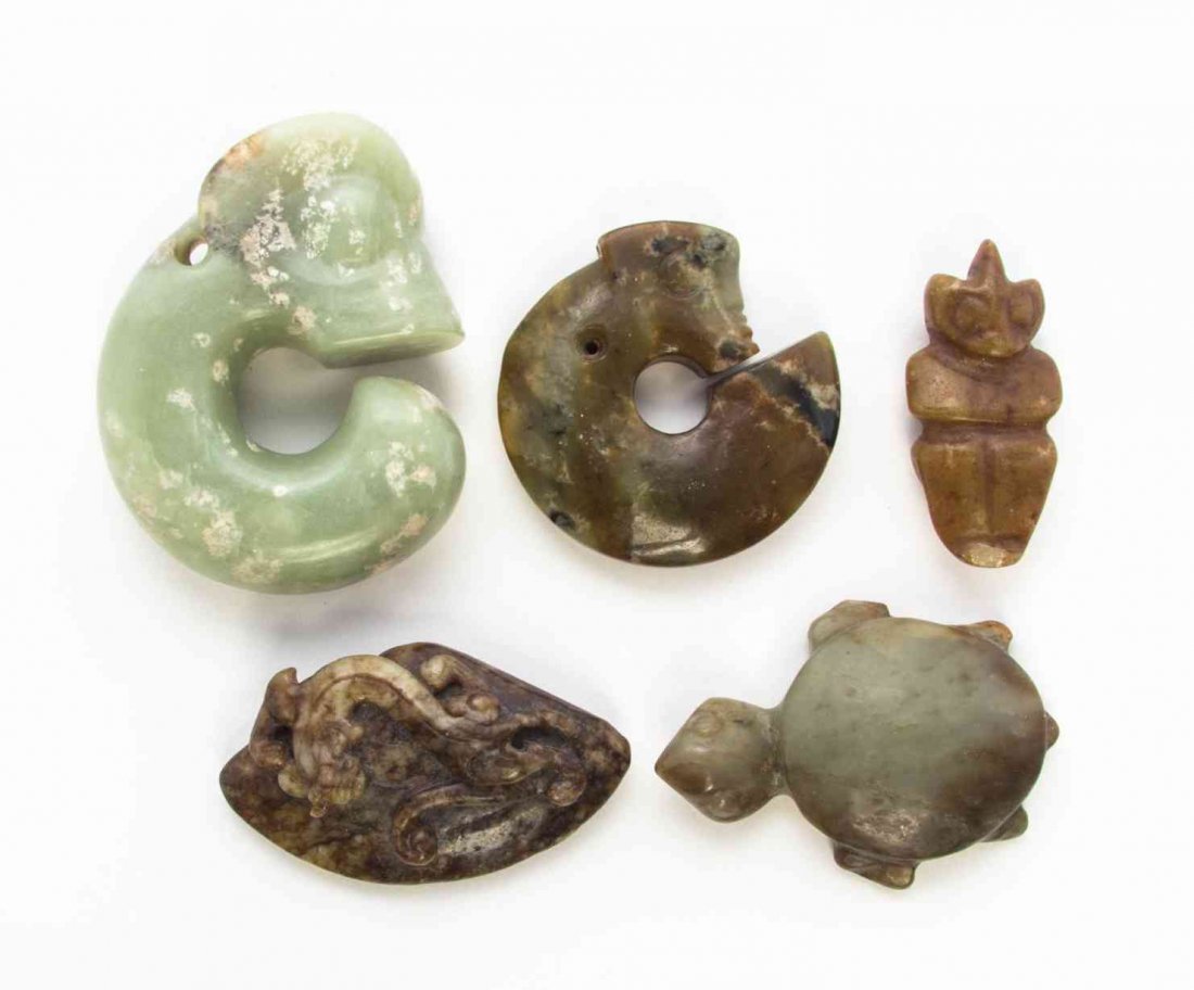 Five Carved Jade and Hardstone Articles, Height of: Five Carved Jade and Hardstone Articles, comprising two hardstone Liangzhu style dragons, a tortoise, a figural toggle and a russet stone example with chilong and clam. Height of tallest 3 3/8 inches.