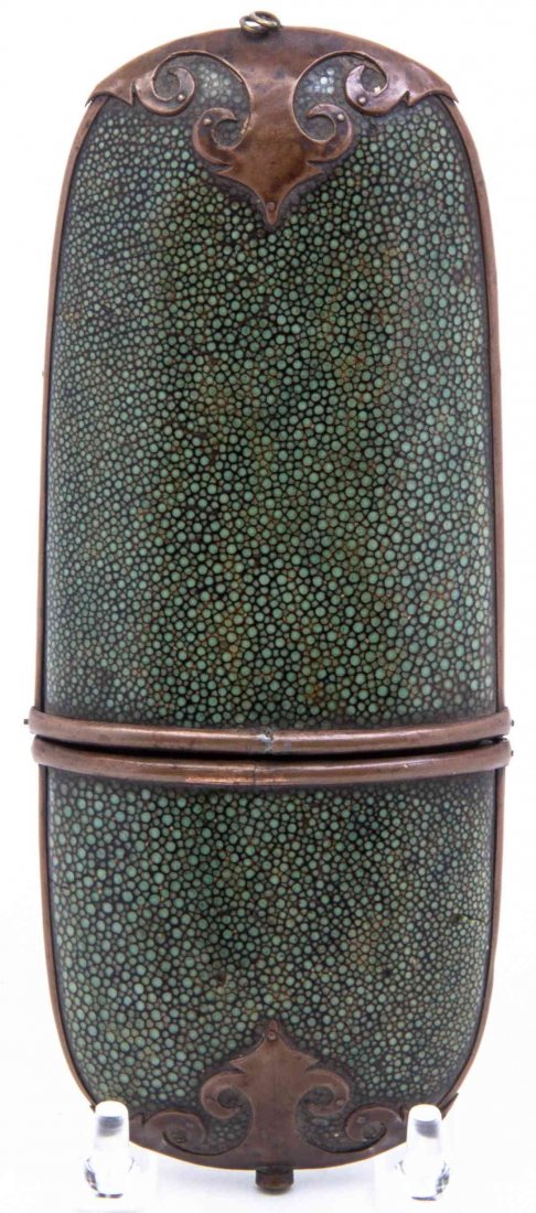 A Copper Mounted Shagreen Eyeglasses Case. Height 7 3/8: A Copper Mounted Shagreen Eyeglasses Case. Height 7 3/8 inches. Condition: light loss, scattered areas of cracking and repair consisent with age and use.