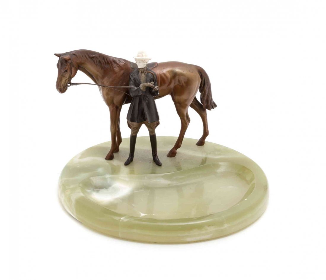 A Cold Painted Bronze Figural Ash Receiver, Height 5: A Cold Painted Bronze Figural Ash Receiver, depicting a horse and rider, set on a circular onyx base. Height 5 3/4 x width 8 1/2 inches.