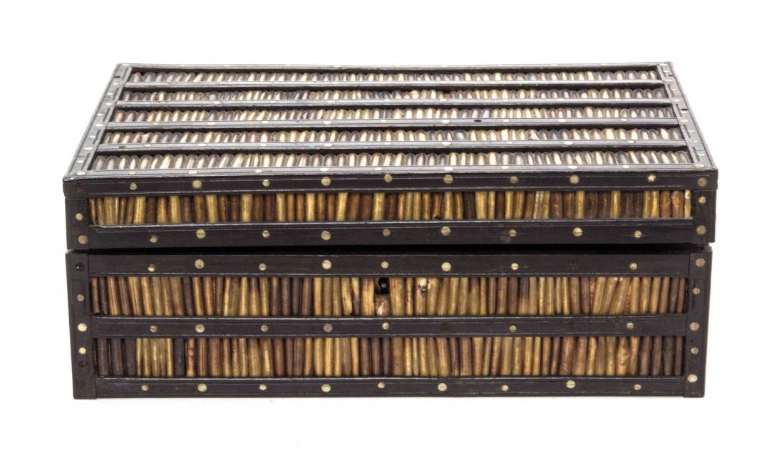 A Porcupine Quill Box, Height 4 x width 10 1/2 x depth: A Porcupine Quill Box, 19th century, with ebony framework. Height 4 x width 10 1/2 x depth 7 1/4 inches.