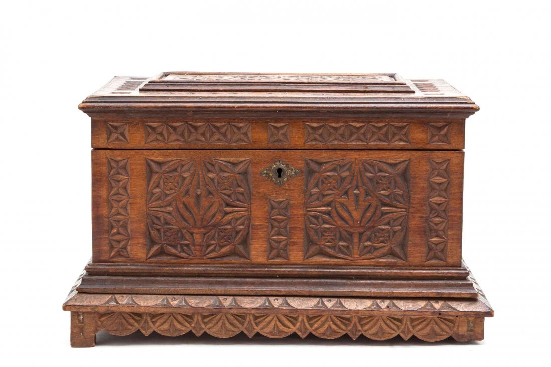 A Carved Wood Document Box, Height 9 1/4 x width 14 1/2: A Carved Wood Document Box, 19th/20th century, in rectangular form, the hinged top having carved geometric designs to the top and opening to an unlined interior, the body having carved geometric panel