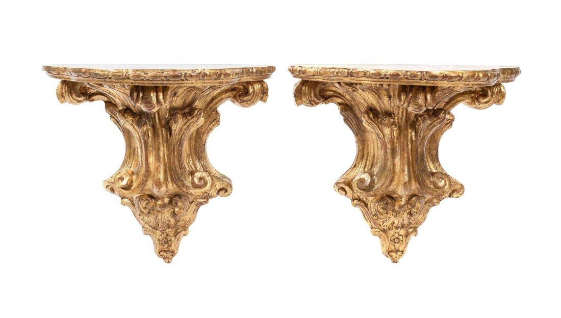 A Pair of Rococo-style Gilt Composition Brackets,: A Pair of Rococo-style Gilt Composition Brackets, 20th century, the shaped top having molded edge above an acanthus scroll base. Height 16 x width 17 inches.